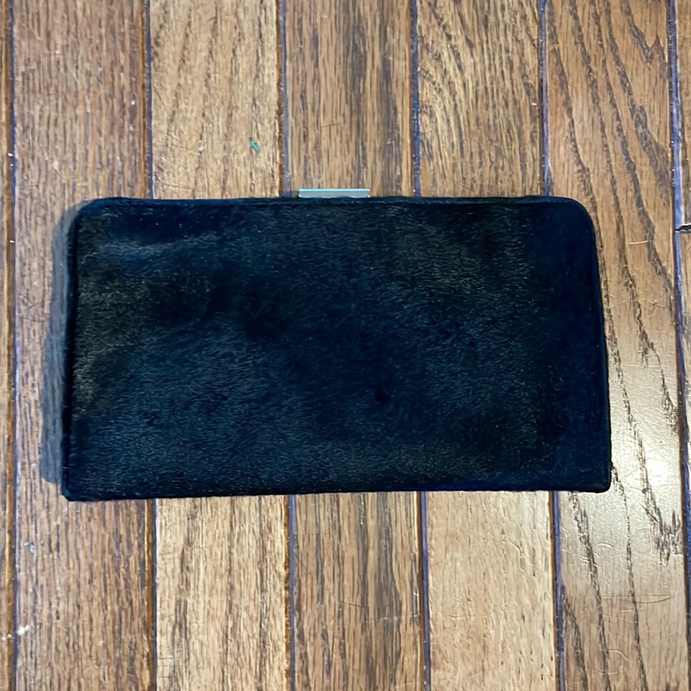 Elegant black COACH calf hair clutch